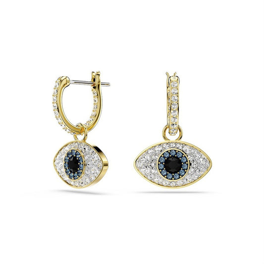The Swarovski Symbolica Evil Eye Drop Earrings blend protection and style, featuring gold hoop earrings with dangling eye-shaped charms encrusted with white crystals and a central dark blue gem.