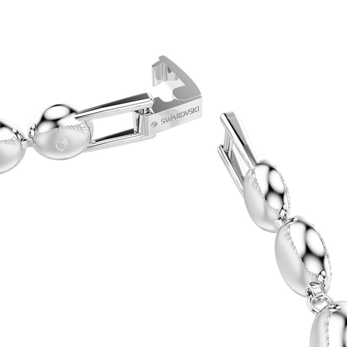 Close-up of the Swarovski Una Angelic bracelet, featuring round-cut white crystals set in rhodium-plated links, with a clasp engraved “SWAROVSKI”, exemplifying the brand’s refined elegance against a plain white background.