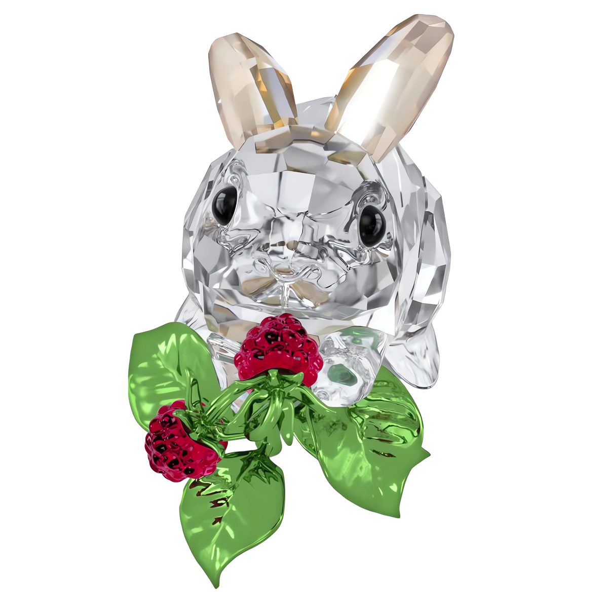 The Swarovski Idyllia Rabbit and Raspberries by Swarovski features a clear crystal rabbit with black eyes and light brown-tinted ears, delicately holding two red crystal raspberries and green crystal leaves in its mouth—a charming decoration that brings an elegant touch to any home décor.