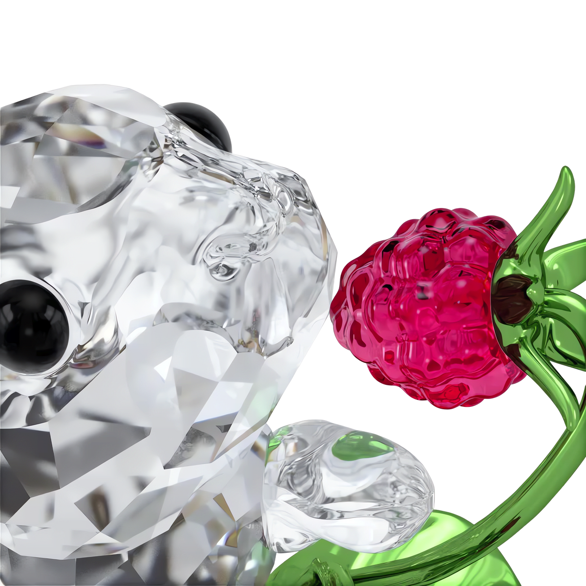 The Swarovski Idyllia Rabbit and Raspberries figurine by Swarovski features a faceted crystal rabbit holding a red raspberry on a green stem, set against a plain white background—an elegant addition to your home décor.