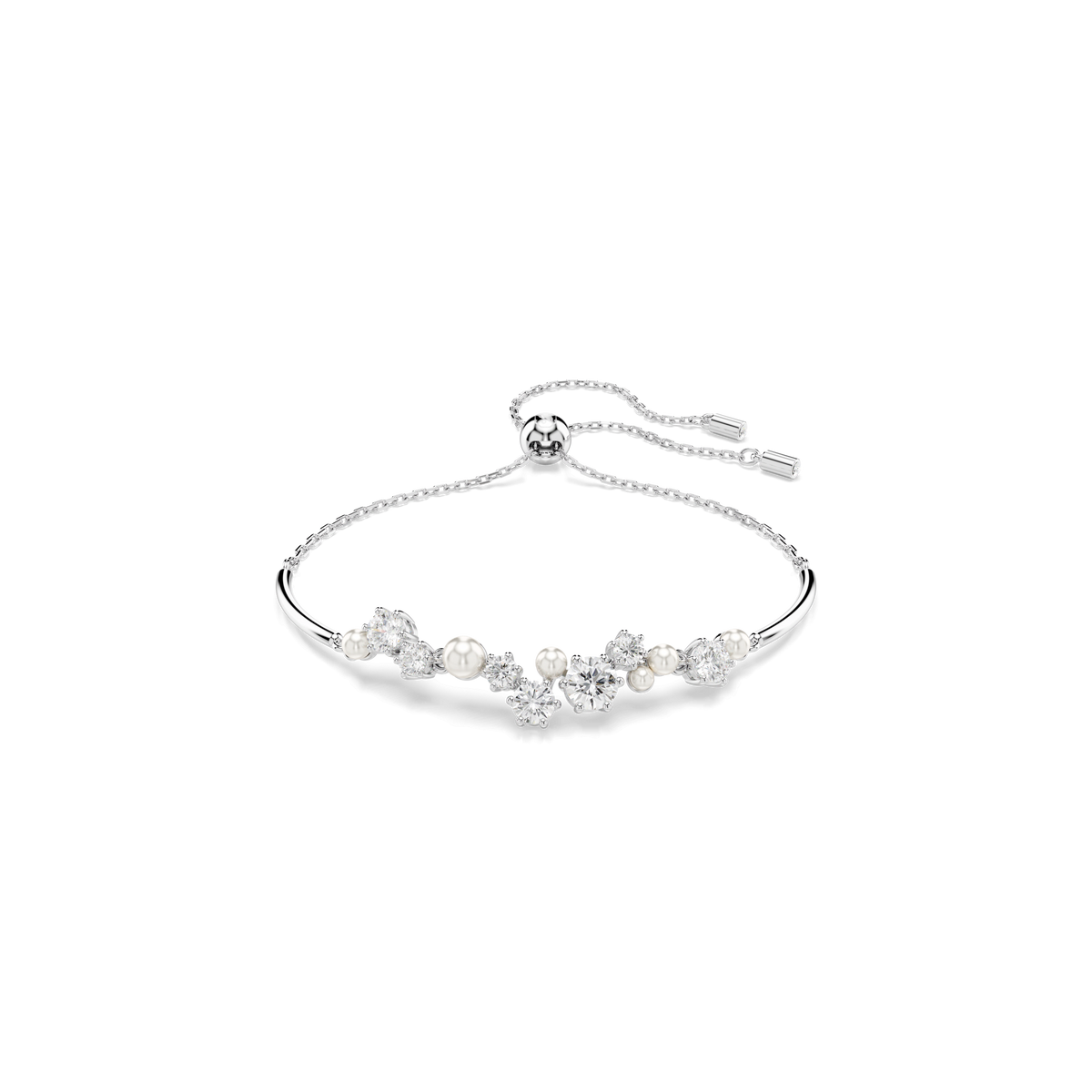 A refined Swarovski Constella bangle, crafted in rhodium plating, showcases round-cut Swarovski Zirconia and luminous crystal pearls elegantly arranged along the front.