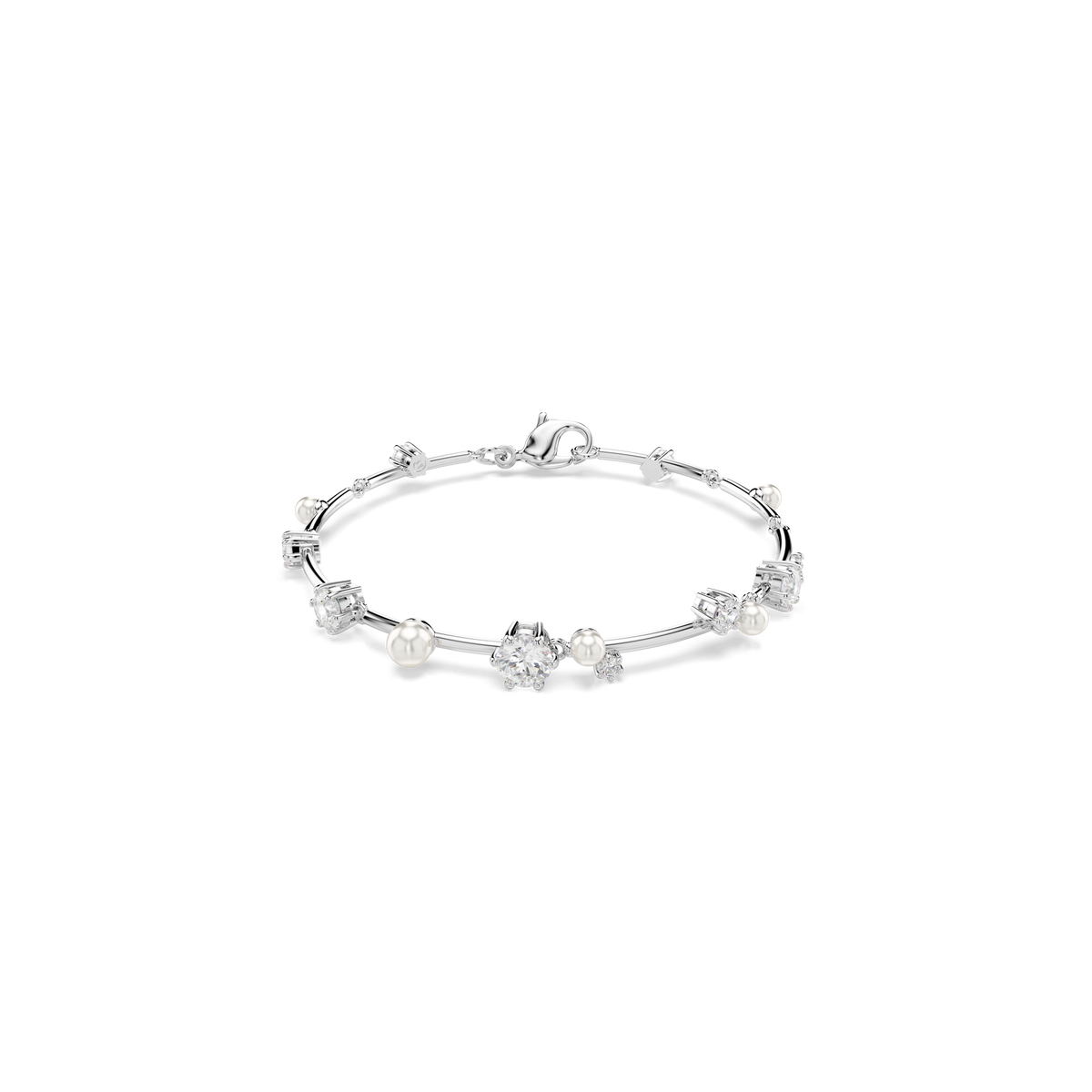 The Swarovski Constella Tennis bracelet by Swarovski showcases a refined silver design with alternating pearls and sparkling crystals, secured with a lobster clasp—an elegant accessory reminiscent of those at Raffi Jewellers—captured beautifully against a plain white background.