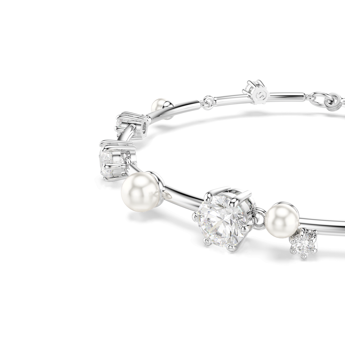 Swarovski’s Constella Tennis bracelet—a silver piece embellished with pearls, clear gemstones, and cubic elements reminiscent of refined Raffi Jewellers designs—is elegantly displayed against a light background.
