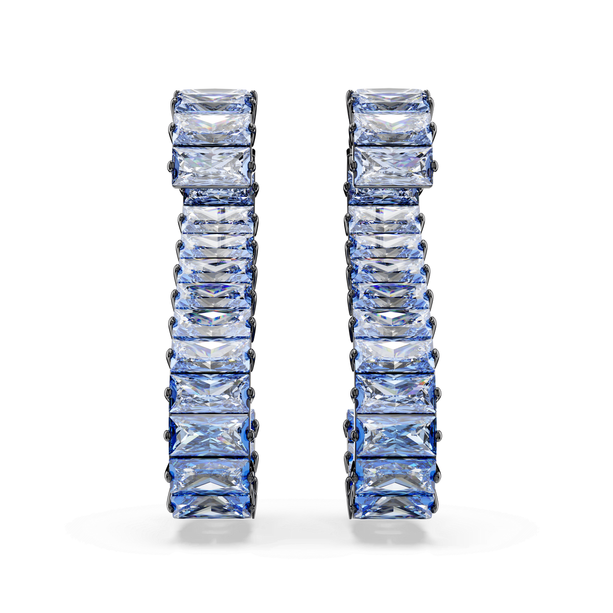 A pair of Swarovski Matrix Drop Earrings, featuring baguette-cut blue gemstones arranged vertically and set in a ruthenium-plated design, displayed upright against a plain white background. These elegant earrings exemplify the brilliance and refined craftsmanship associated with Swarovski.
