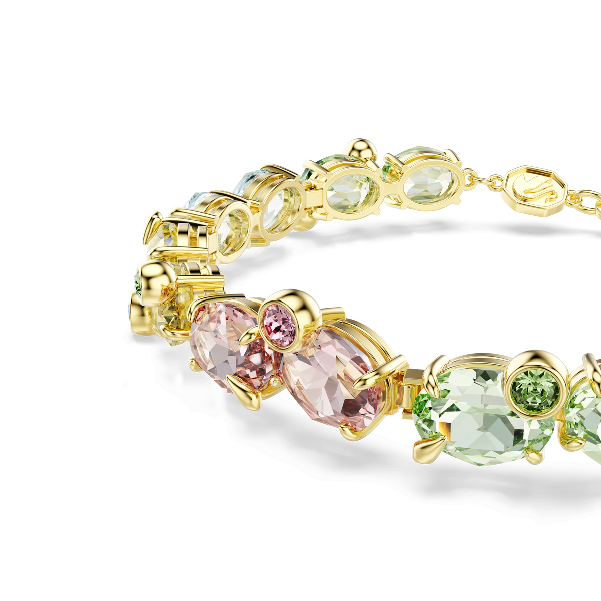 The Swarovski Gema bracelet showcases mixed-cut multicolored gemstones in lively pink, green, and yellow tones, set in an elegant 18K gold finish and displayed against a white background.