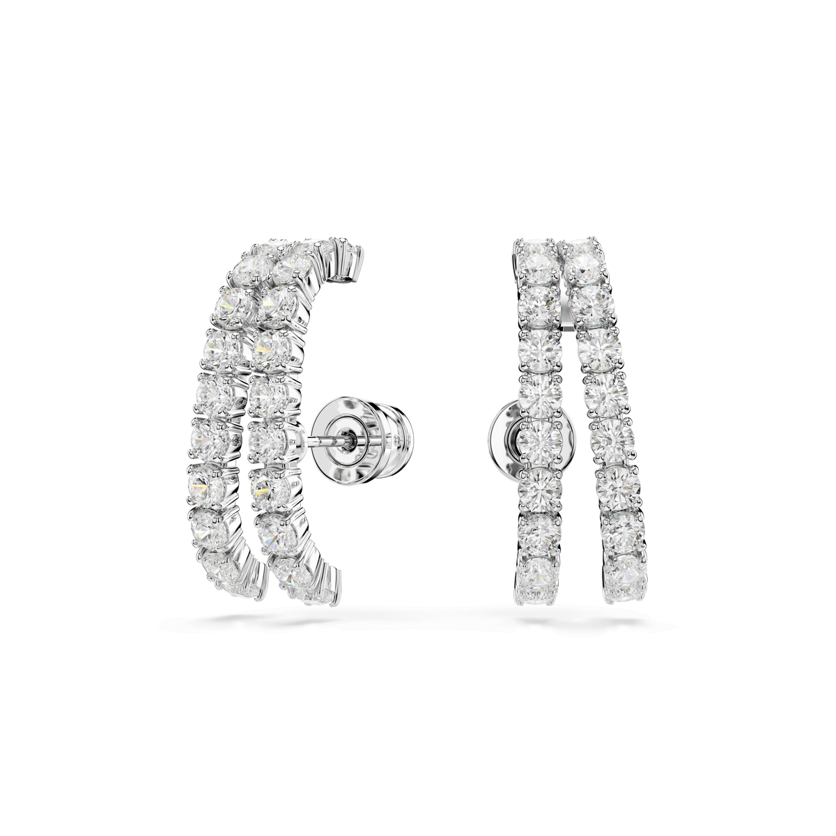 A pair of Swarovski Matrix ear cuffs featuring two parallel rows of sparkling round diamonds, shown against a white background. Available at Raffi Jewellers and Swarovski Canada.