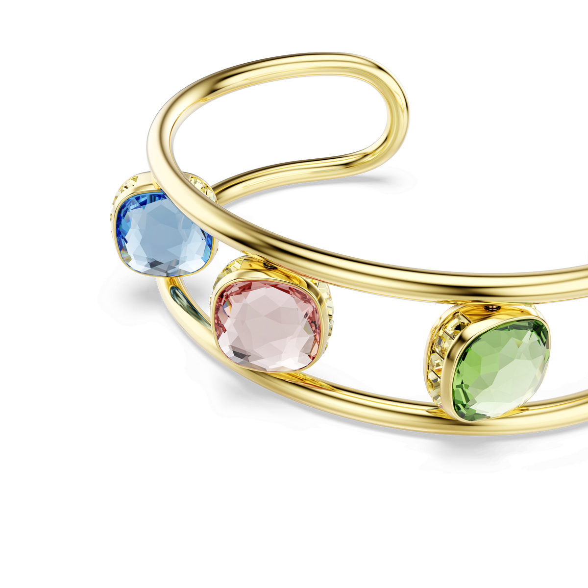 A gold-tone plated Swarovski Chroma cuff from Swarovski, featuring cushion-cut green gemstones in an eye-catching bezel setting—an elegant and vibrant statement piece.