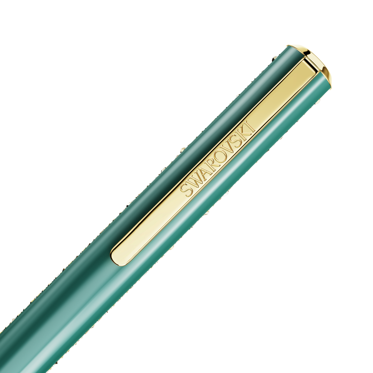 A close-up of the Swarovski Shimmer Glide Ballpoint Pen in green, featuring a gold clip engraved with “SWAROVSKI,” is positioned diagonally on a white background. Available from official Swarovski Canada, this elegant writing instrument combines sophisticated design with sparkling gold crystals for a touch of luxury.