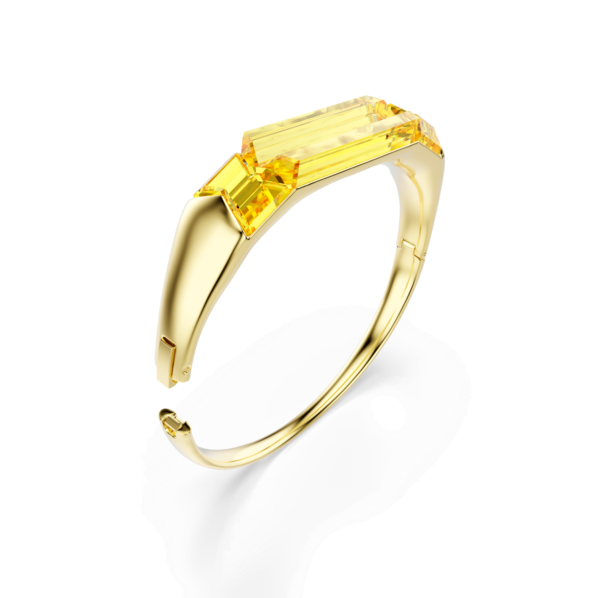 The Swarovski Lucent bangle in yellow features a gold-tone plated bracelet with a geometric gemstone centerpiece and a sleek, modern design, reminiscent of iconic Swarovski style, showcased against a white background.