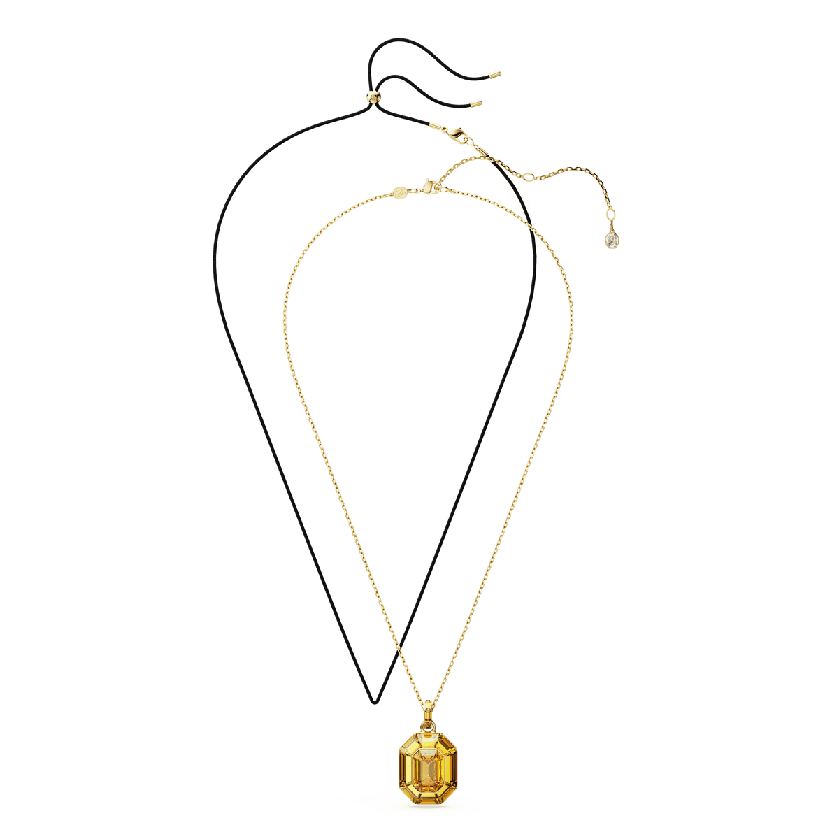 Two necklaces are displayed: one with a thin black cord and the other featuring the Swarovski Lucent Pendant, which showcases a large yellow octagon-shaped crystal on a delicate gold-tone plated chain. Both necklaces are laid flat on a white background.