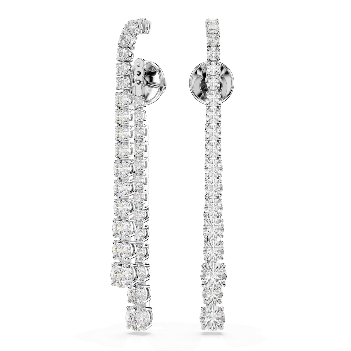 Set against a plain white background, the Swarovski Matrix drop earrings by Swarovski feature a gradient of round white stones in an elegant rhodium plated finish. The pair showcases a modern design with one earring gracefully curved and the other straight, creating a striking asymmetrical effect.