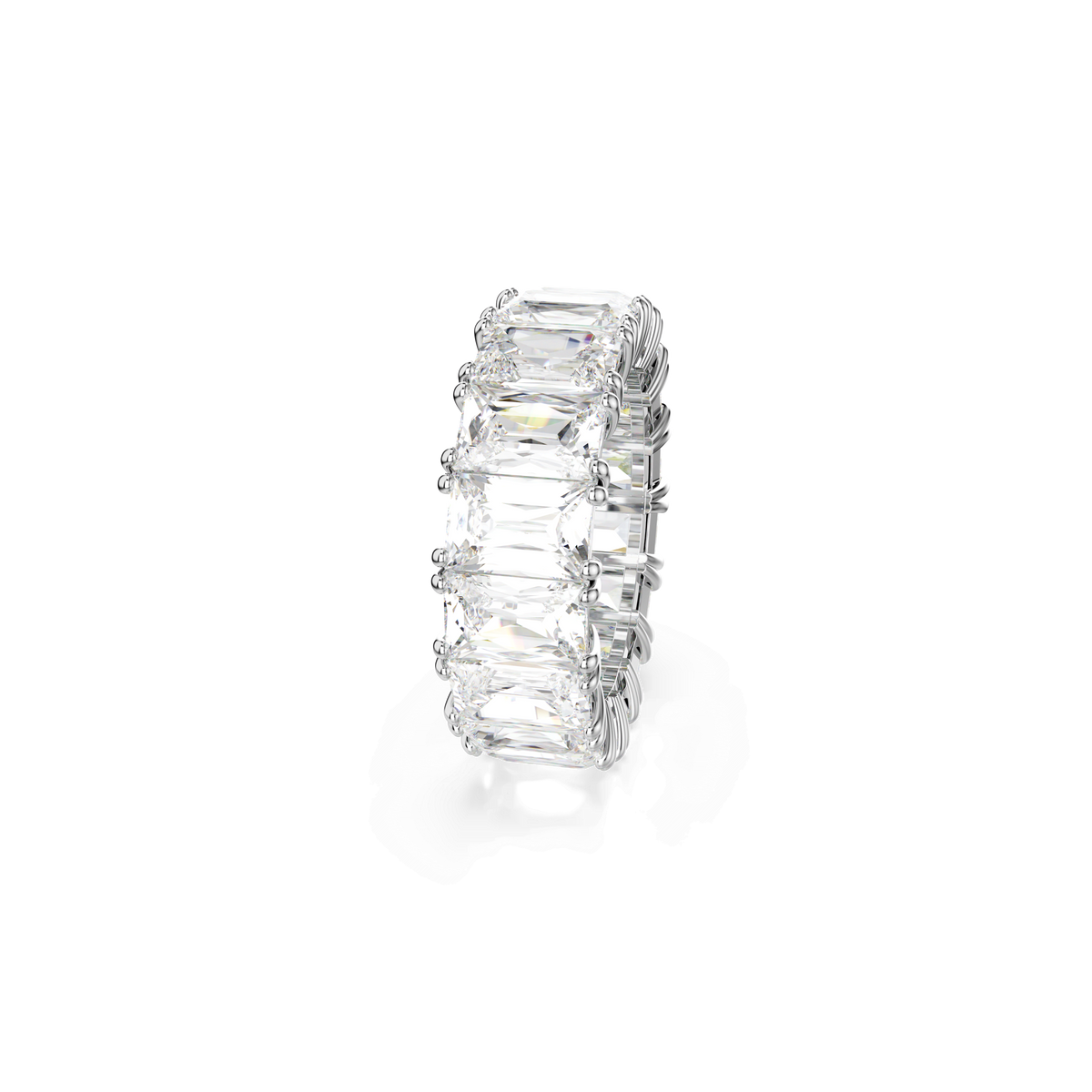 The Swarovski Matrix Vittore ring showcases sparkling baguette-cut white stones set in a continuous band of rhodium plating, creating a striking and sophisticated stacking piece, elegantly displayed against a plain white background.