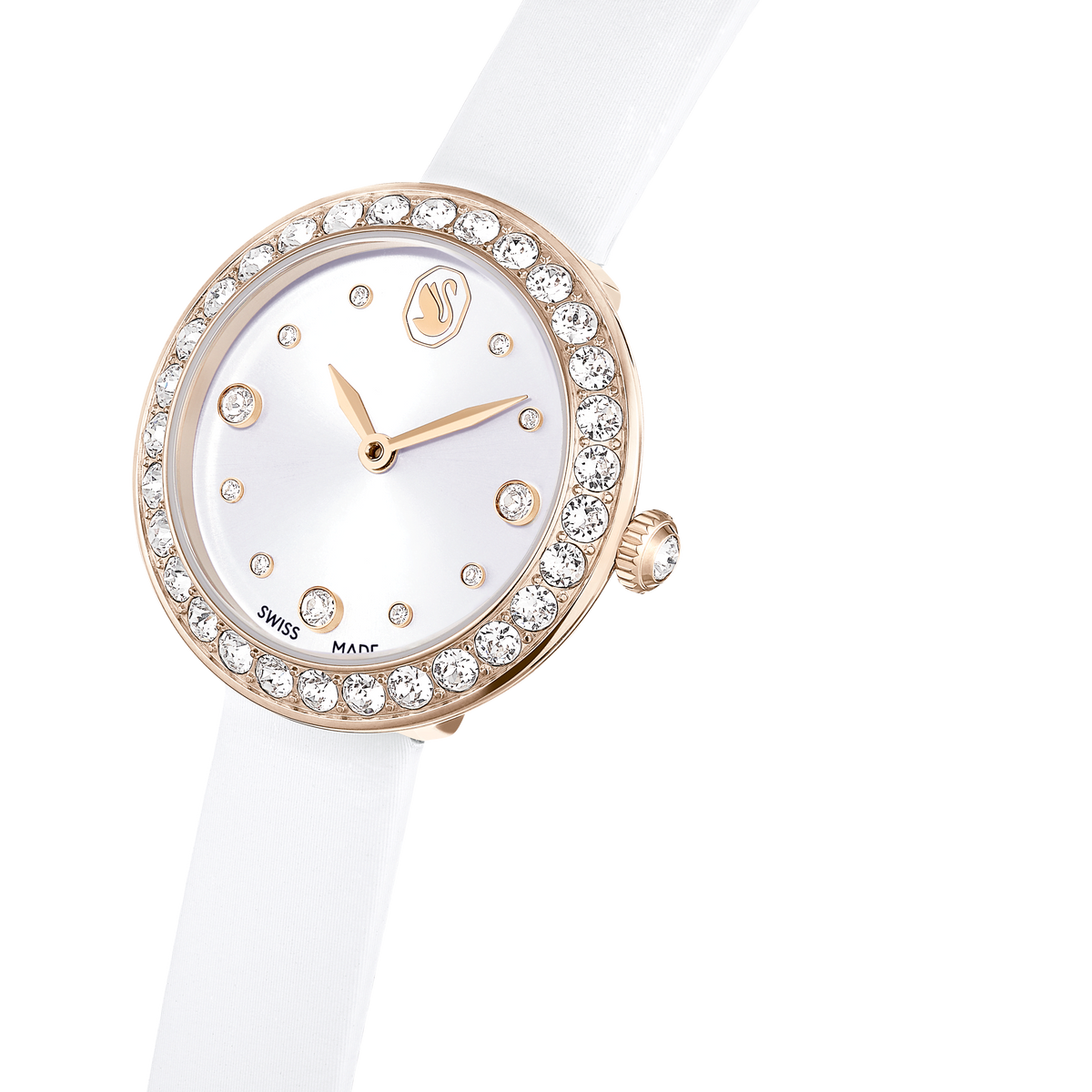 A Swarovski Matrix Tennis watch Swiss Made, featuring a white leather strap and a round face with crystal hour markers and a crystal-studded bezel in a champagne gold-tone finish, is displayed on a white background. This elegant timepiece from Swarovski perfectly captures timeless sophistication reminiscent of the refined style found at Raffi Jewellers.
