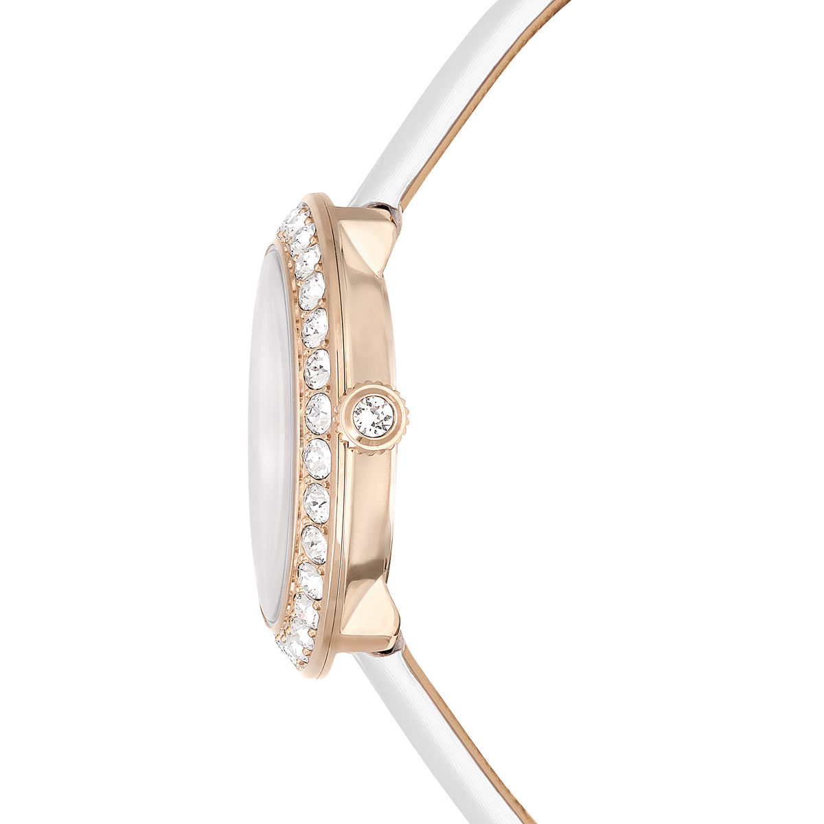 Side view of the Swarovski Matrix Tennis watch Swiss Made, featuring a white leather strap and a round bezel embellished with clear gemstones, complemented by a gem-set crown in a champagne gold-tone finish. Displayed against a plain white background, this elegant timepiece is available exclusively through an authorized Swarovski retailer.