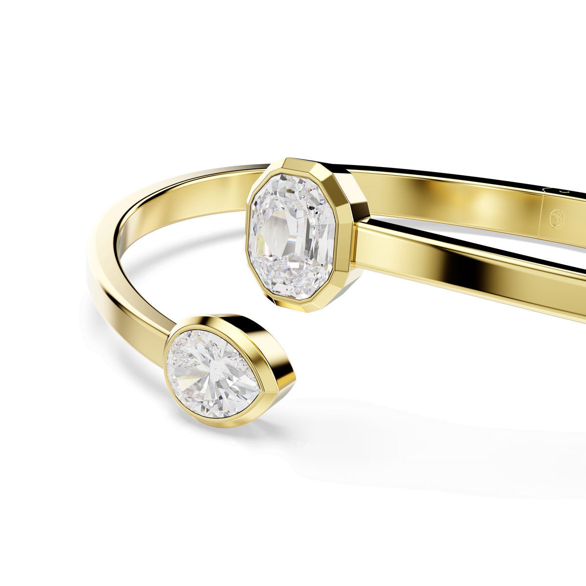 A close-up of the Swarovski Imber bangle showcases its 18K gold finish and two geometric settings—a round and an oval—each sparkling with mixed-cut Swarovski Zirconia, set against a plain white background to highlight this elegant luxury jewelry piece by Swarovski.