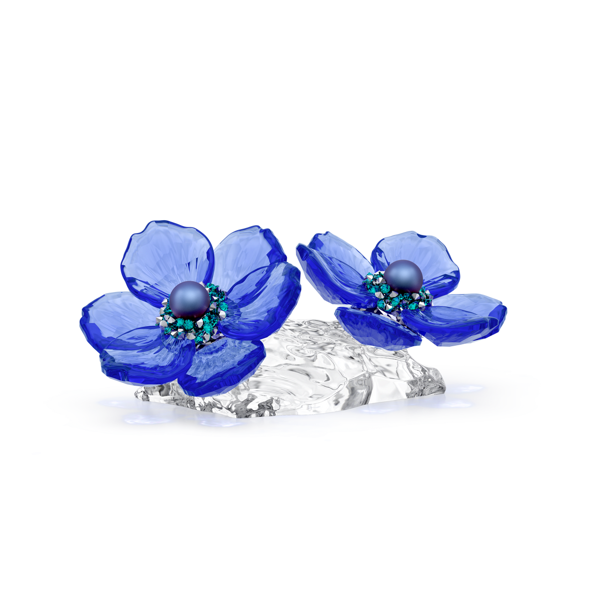 Two artistic blue crystal anemone coronaria flowers with detailed centers rest on a clear, textured base against a plain white background—a refined piece of botanical décor from Swarovski, enhanced by the elegance of Swarovski Crystal Pearls. This is the Swarovski Idyllia SCS Anemone Coronaria Flower.