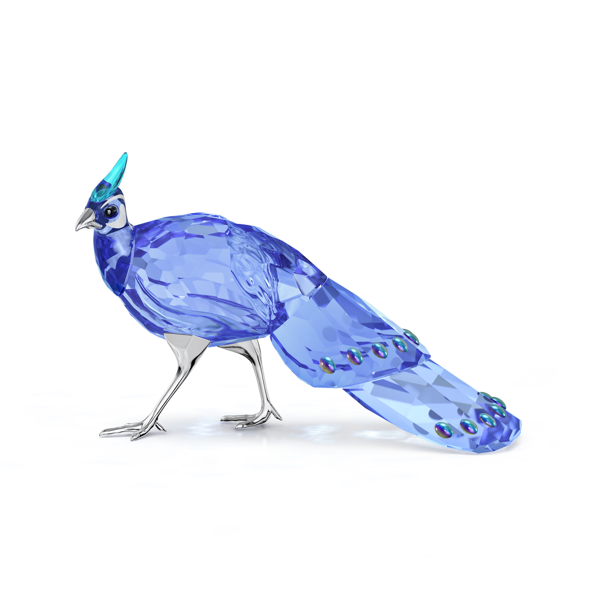 The Swarovski Idyllia SCS Palawan Peacock-Pheasant by Swarovski is a blue crystal bird figurine featuring a faceted body and tail, silver legs, and a detailed head, displayed against a plain white background.