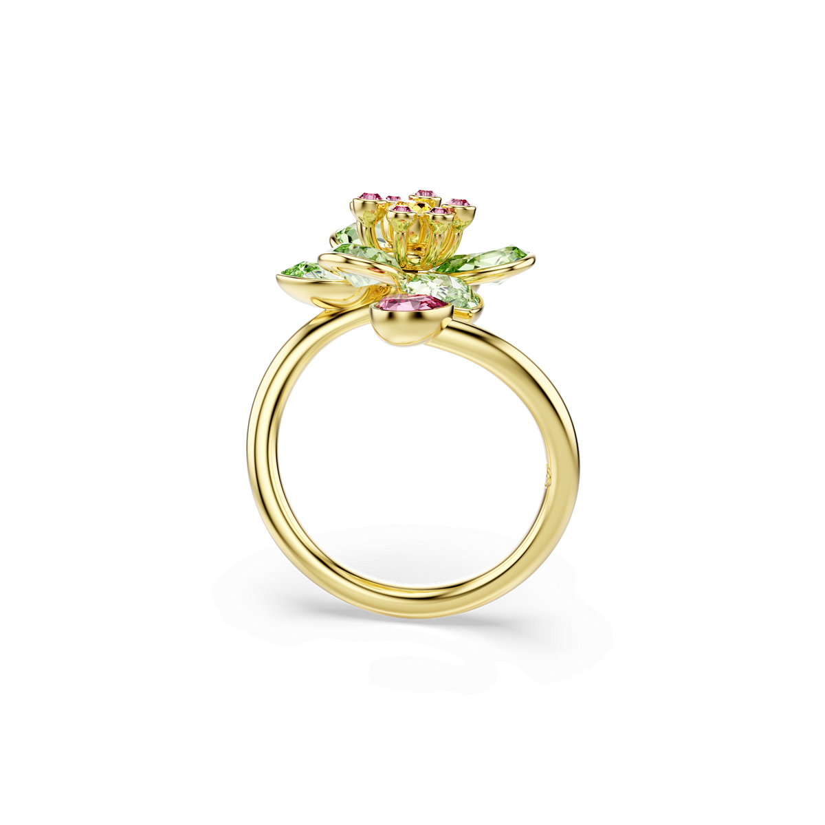 The Swarovski Idyllia open ring by Swarovski features a detailed flower motif on top, adorned with mixed-cut green crystals as petals and finished in 18K gold, showcased against a plain white background.