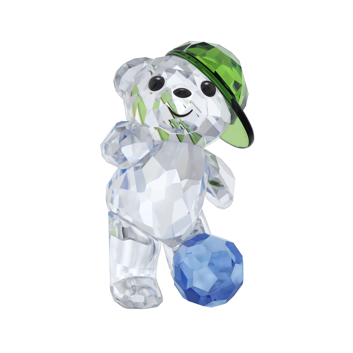 The Swarovski Kris Bear Goal Scorer Bear by Swarovski features a faceted crystal bear wearing a green cap and playfully posing with one foot on a blue soccer ball against a white background, making it a delightful collectible or sports gift for soccer fans.