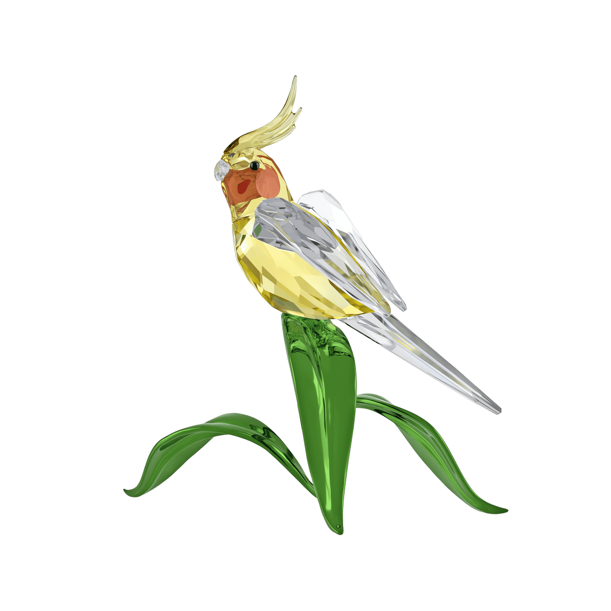 The Swarovski Idyllia Cockatiel by Swarovski is a stunning crystal figurine, featuring a yellow body with an orange cheek patch, gracefully perched on a green glass branch. This elegant decoration is beautifully displayed against a white background, capturing the essence of refined craftsmanship.