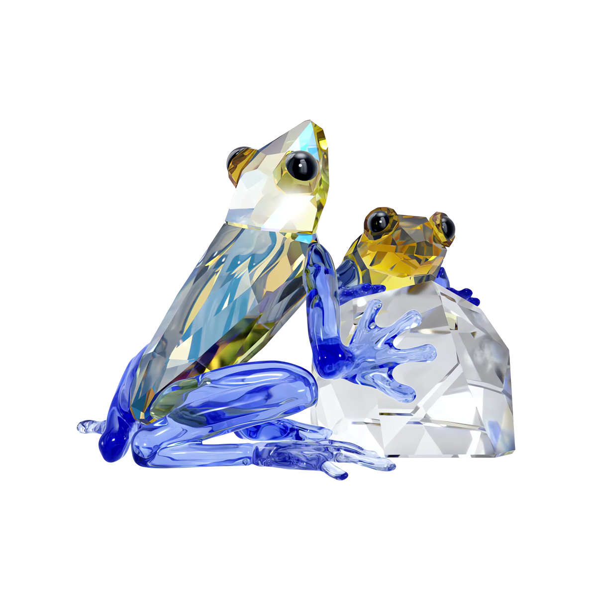 Two crystal frogs from the Swarovski Idyllia Frog and Baby set sit side by side—the larger frog is perched directly on the surface, while the smaller baby frog rests atop a clear crystal rock. Crafted by Swarovski from faceted glass with striking blue legs, these figurines brilliantly reflect light and charmingly capture a scene of parental love—making them an enchanting home decoration.