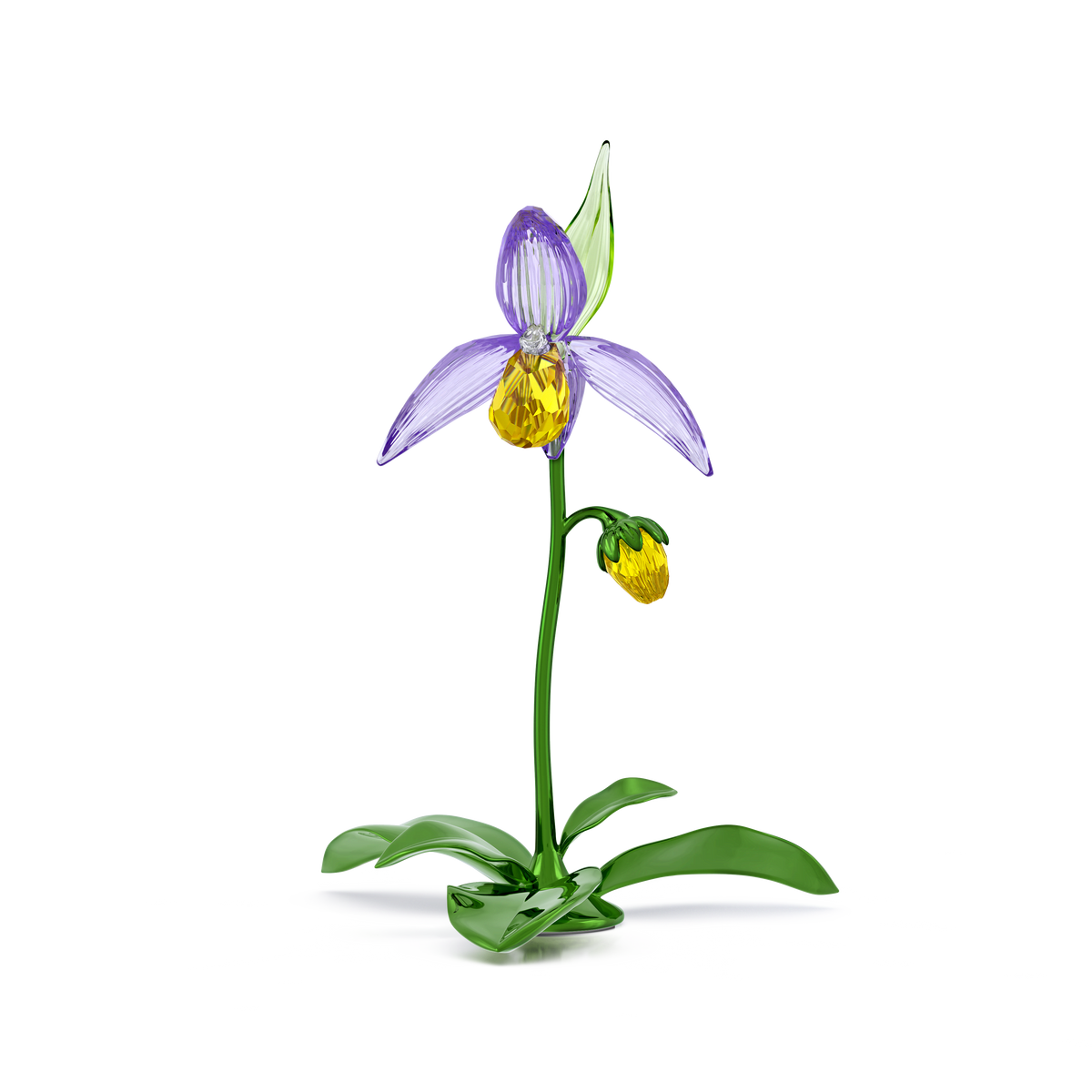 The Swarovski Florere Lady Slipper Orchid by Swarovski is a delicate glass sculpture inspired by a crystallized orchid, featuring purple petals, a yellow center, green leaves, and a small yellow bud, elegantly set against a plain white background.