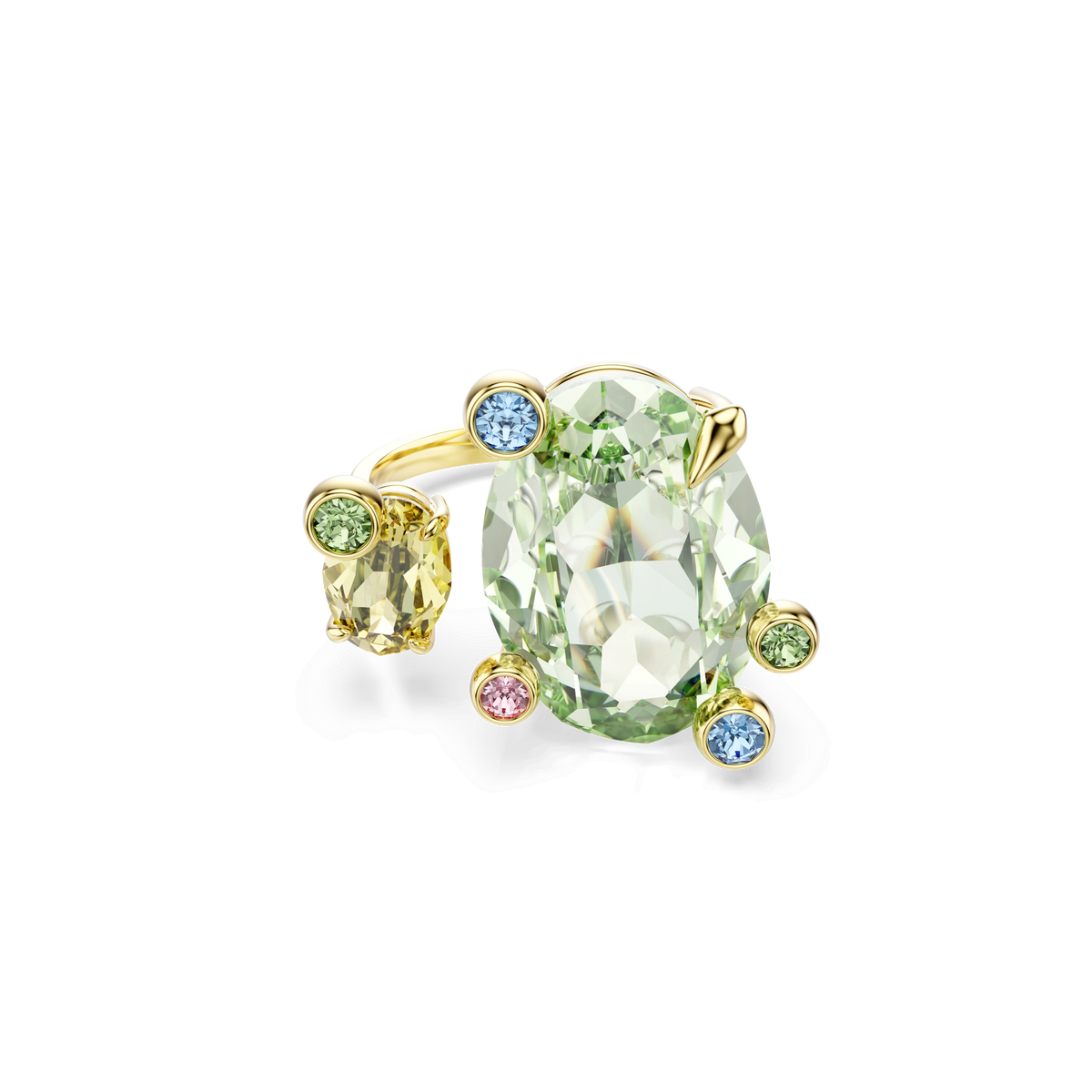 Introducing the Swarovski Gema open ring, a stunning gold-tone plated piece featuring mixed cuts and multicoloured gemstones. This exquisite design showcases an oval pale green gemstone, a smaller yellow stone, and five small round stones in shimmering shades of blue, green, and pink arranged asymmetrically around the central stones. Displayed on a white background. Exclusively available at Raffi Jewellers.