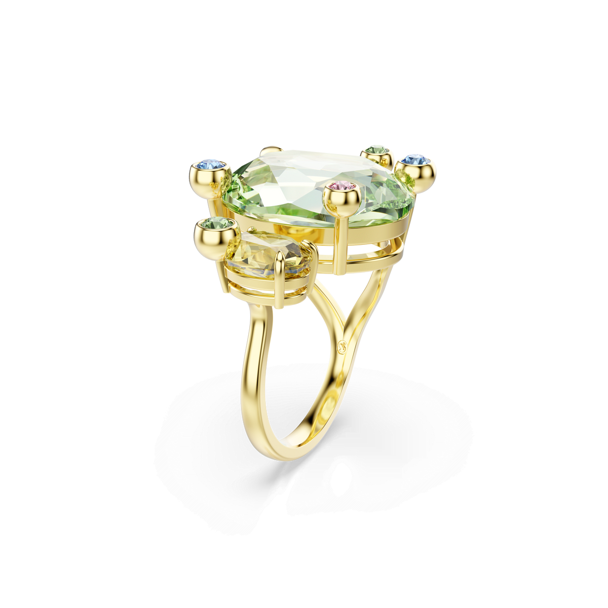 Experience the elegance of the Swarovski Gema open ring from Raffi Jewellers—a gold-tone plated band by Swarovski adorned with a central oval green gemstone and accented by four small multicoloured stones in blue, pink, yellow, and green at each corner.