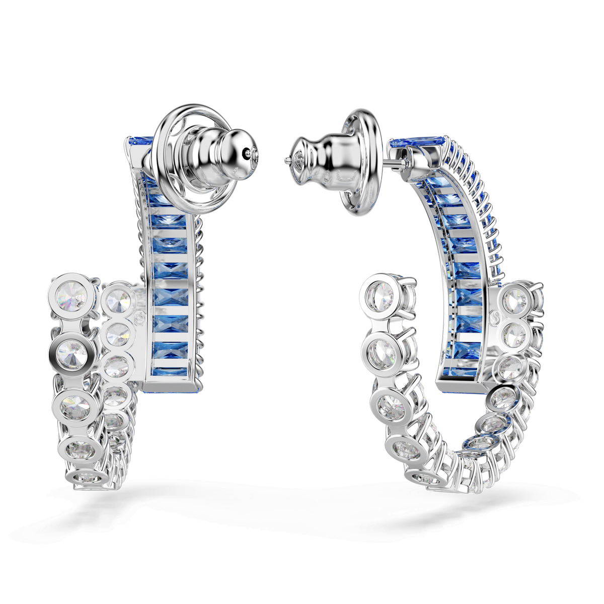 A pair of Swarovski Matrix hoop earrings by Swarovski, featuring blue square-cut stones on the outer edge and clear round stones along the inner curve, crafted with a rhodium-plated finish and shown with the clasps open.