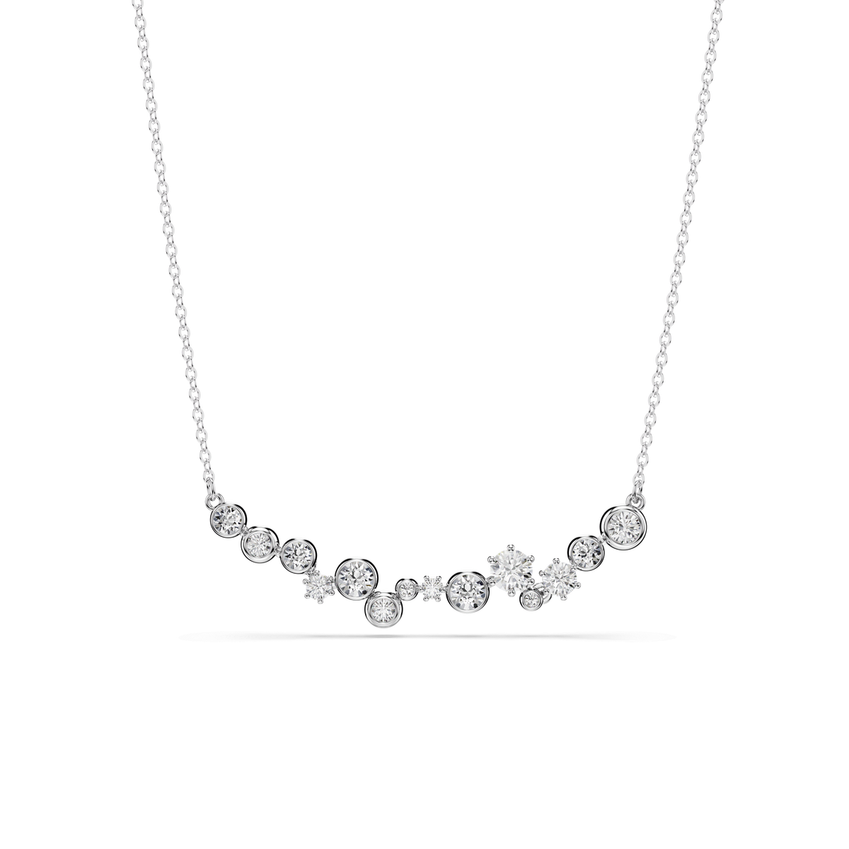 The Swarovski Constella necklace features an array of round and star-shaped clear crystals in mixed cuts, arranged along a fine chain and finished with radiant rhodium plating. Displayed on a white background, this elegant piece by Swarovski is inspired by constellations.