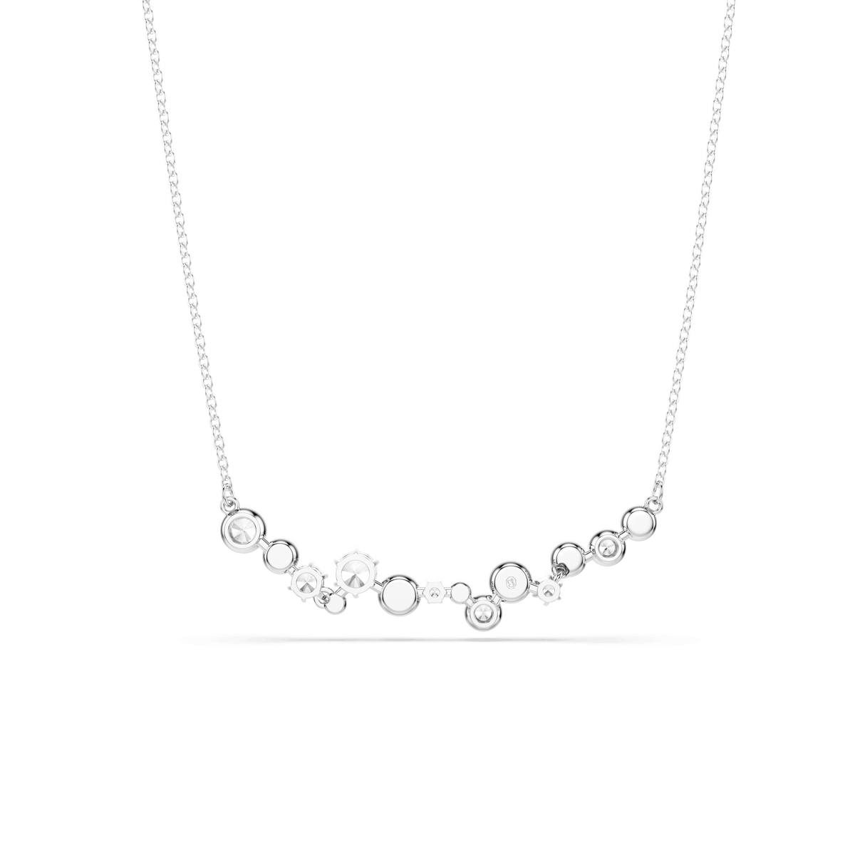 A Swarovski Constella necklace in white, featuring mixed-cut clear crystals arranged in an elegant asymmetrical design across the front, set on a delicate rhodium-plated chain.
