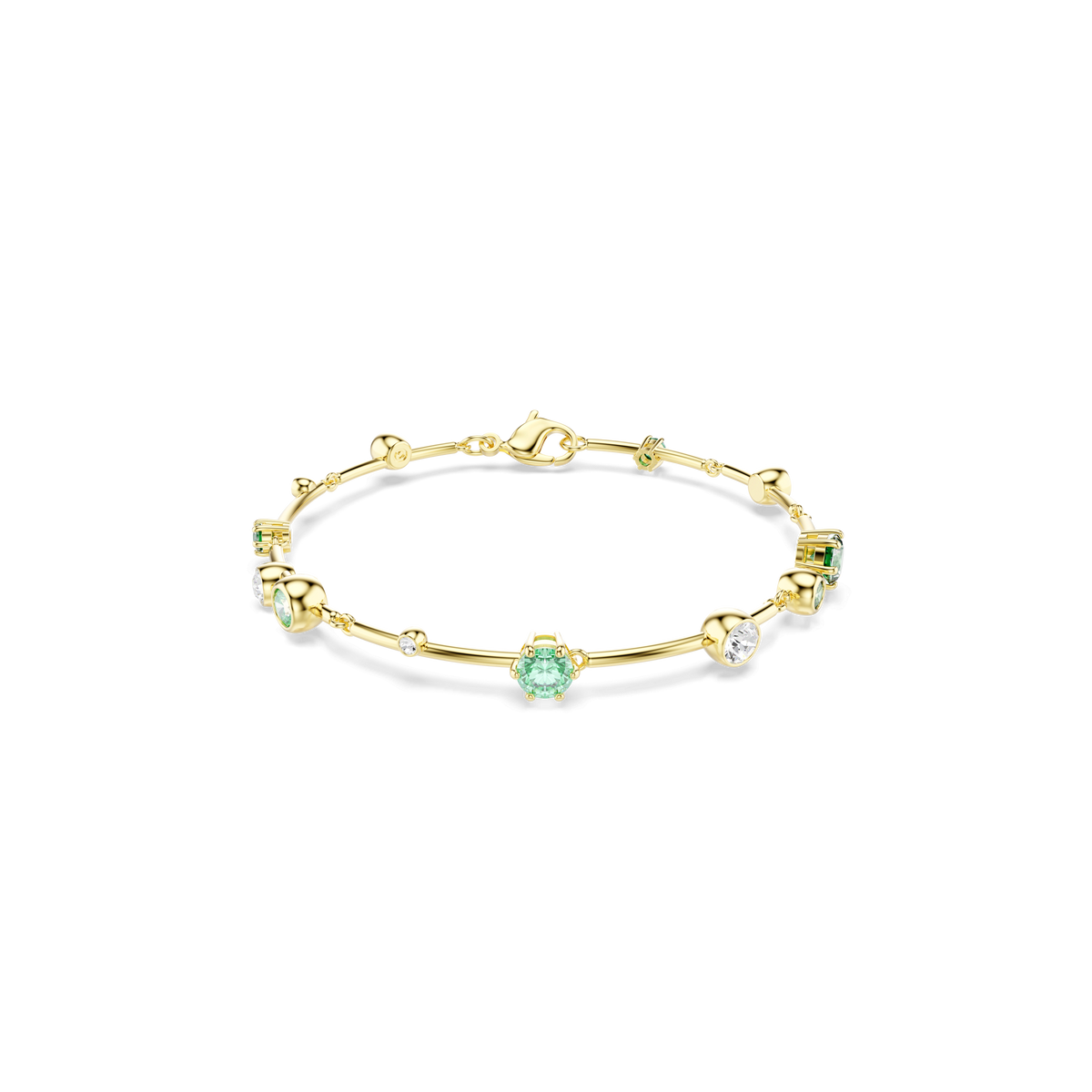 The Swarovski Constella bracelet, crafted with mixed cuts and an elegant 18K gold finish, showcases small green and white gemstones evenly spaced around the band. It is displayed against a plain white background.