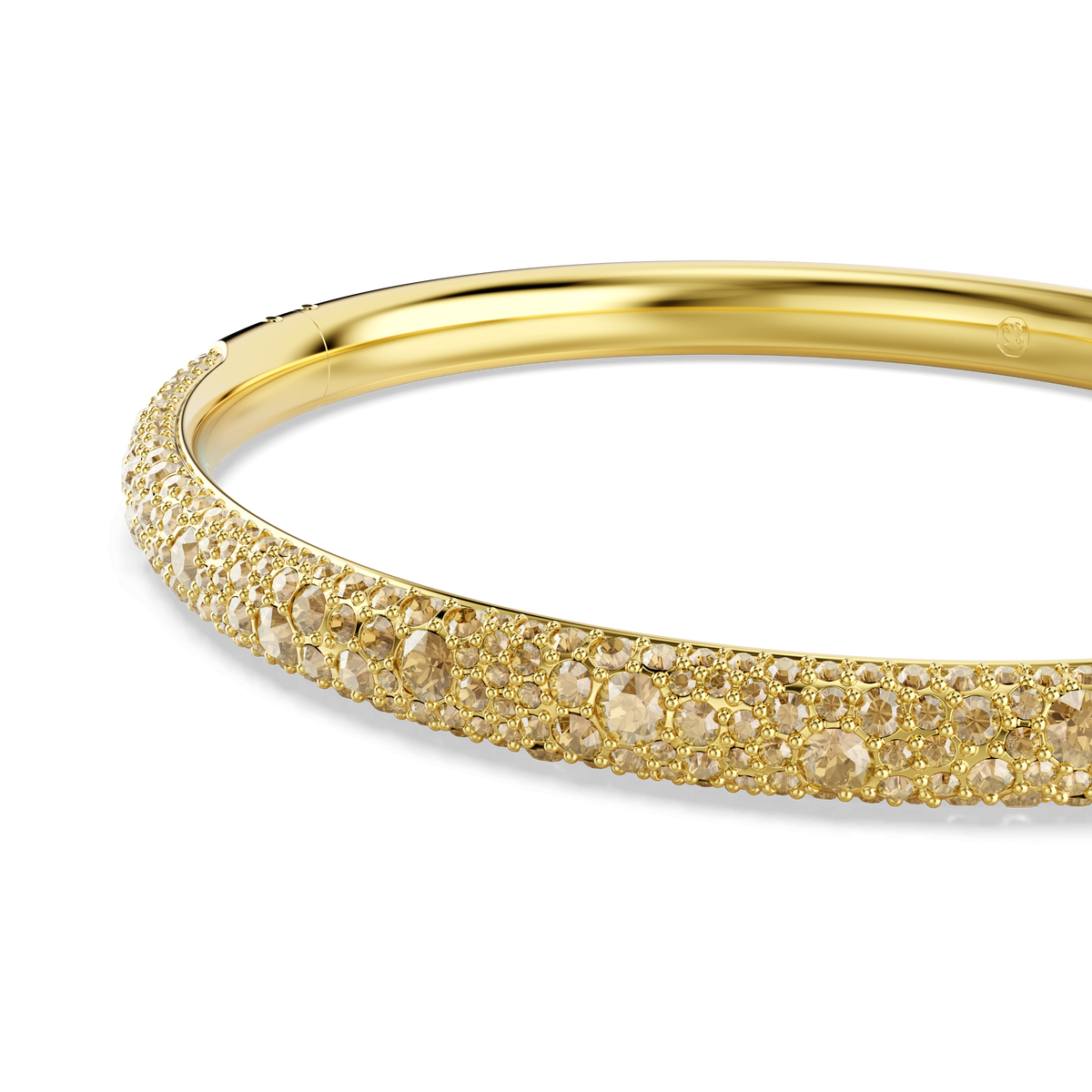 A close-up of the Swarovski Sublima bangle, Snow pavé, featuring sparkling pavé and gold-tone crystals with an 18K gold finish, photographed on a white background.
