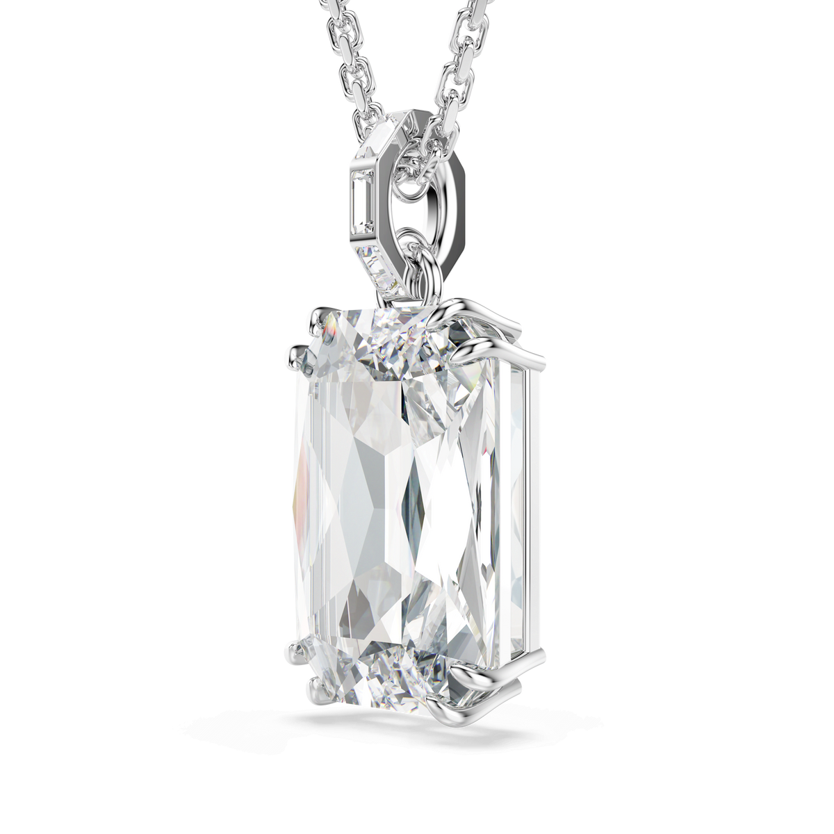 A close-up of the Swarovski Millenia pendant showcases a striking, octagon-cut white gemstone with faceted edges, elegantly set in a decorative prong setting and suspended from a sleek rhodium plated chain against a plain white background.
