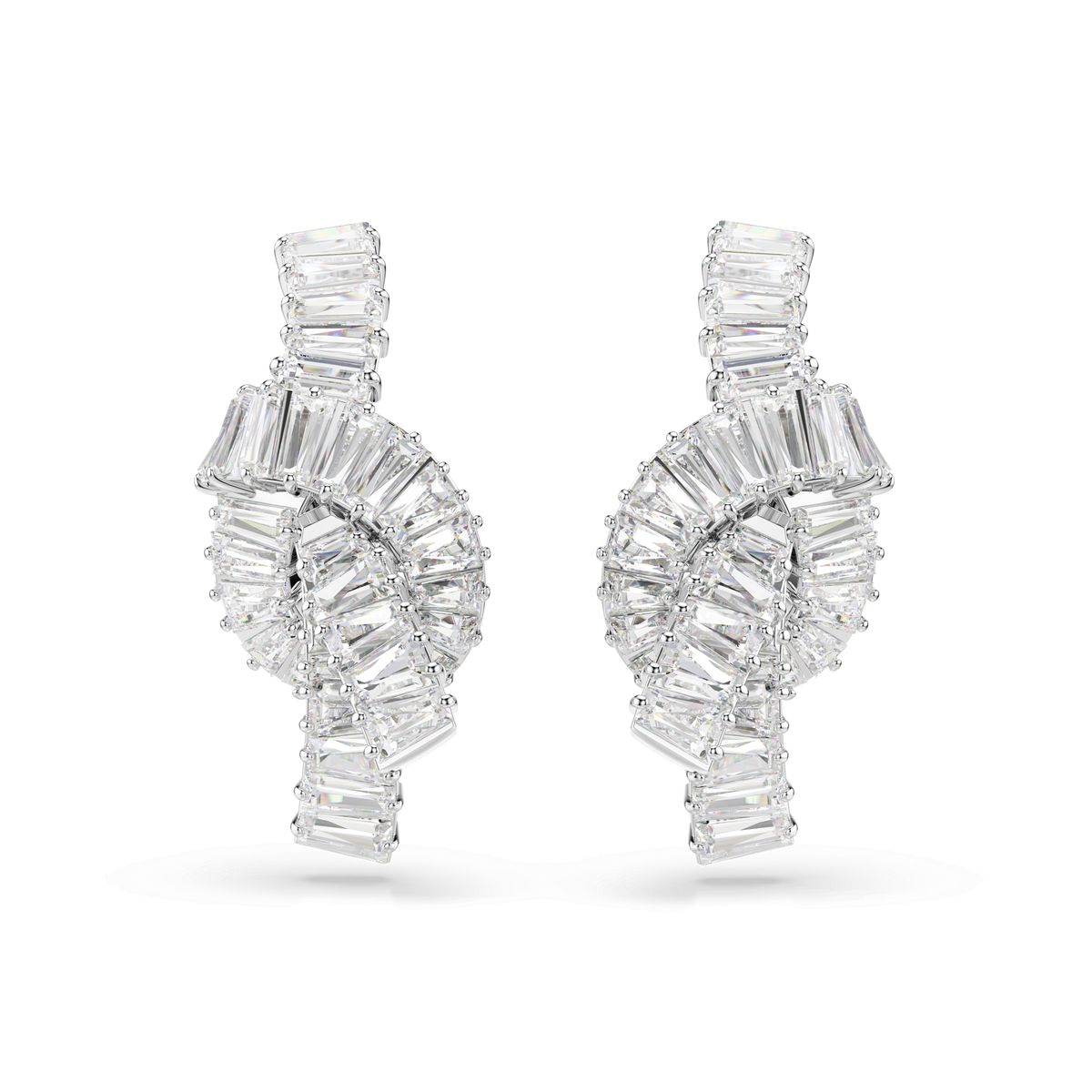 A pair of Swarovski Matrix earrings in white rhodium plating, featuring knot-inspired designs adorned with rectangular, baguette-cut Swarovski Zirconia gemstones from the Swarovski brand.