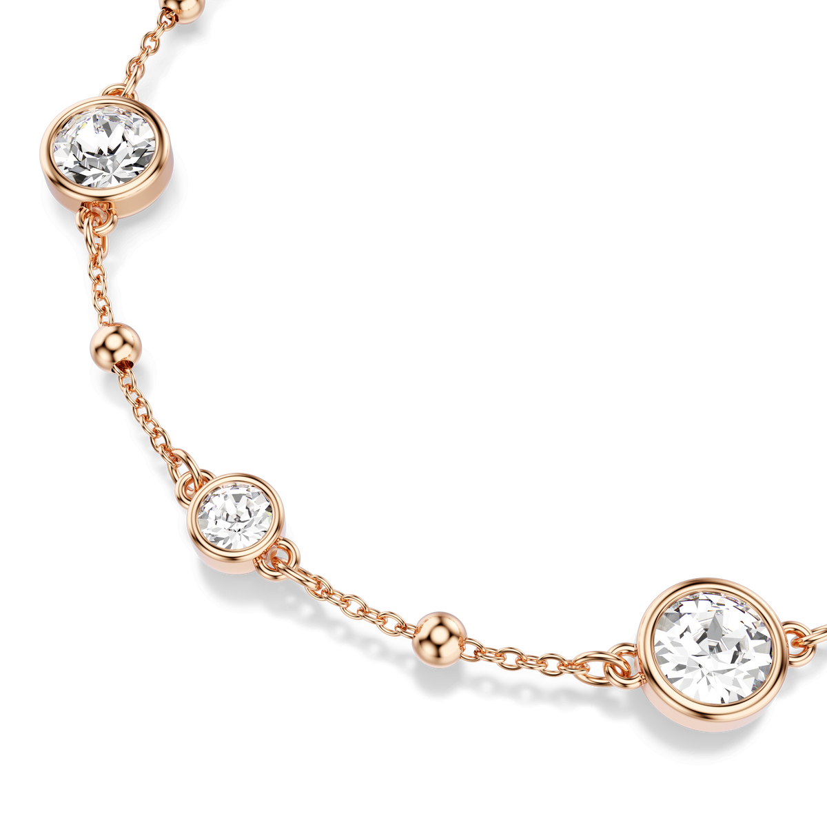 A delicate Swarovski Imber bracelet with an 18K rose gold finish features round-cut white crystals in bezel settings and small gold beads spaced along the chain, displayed on a light background.