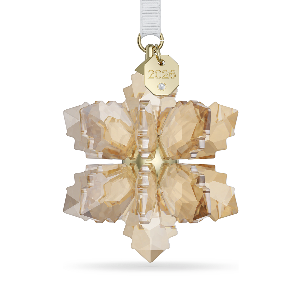 A golden crystal snowflake ornament from the Swarovski Annual Edition Festive 3D Ornament 2026 collection, featuring a gold tag labeled “2026” and a white ribbon for hanging, set against a plain white background.
