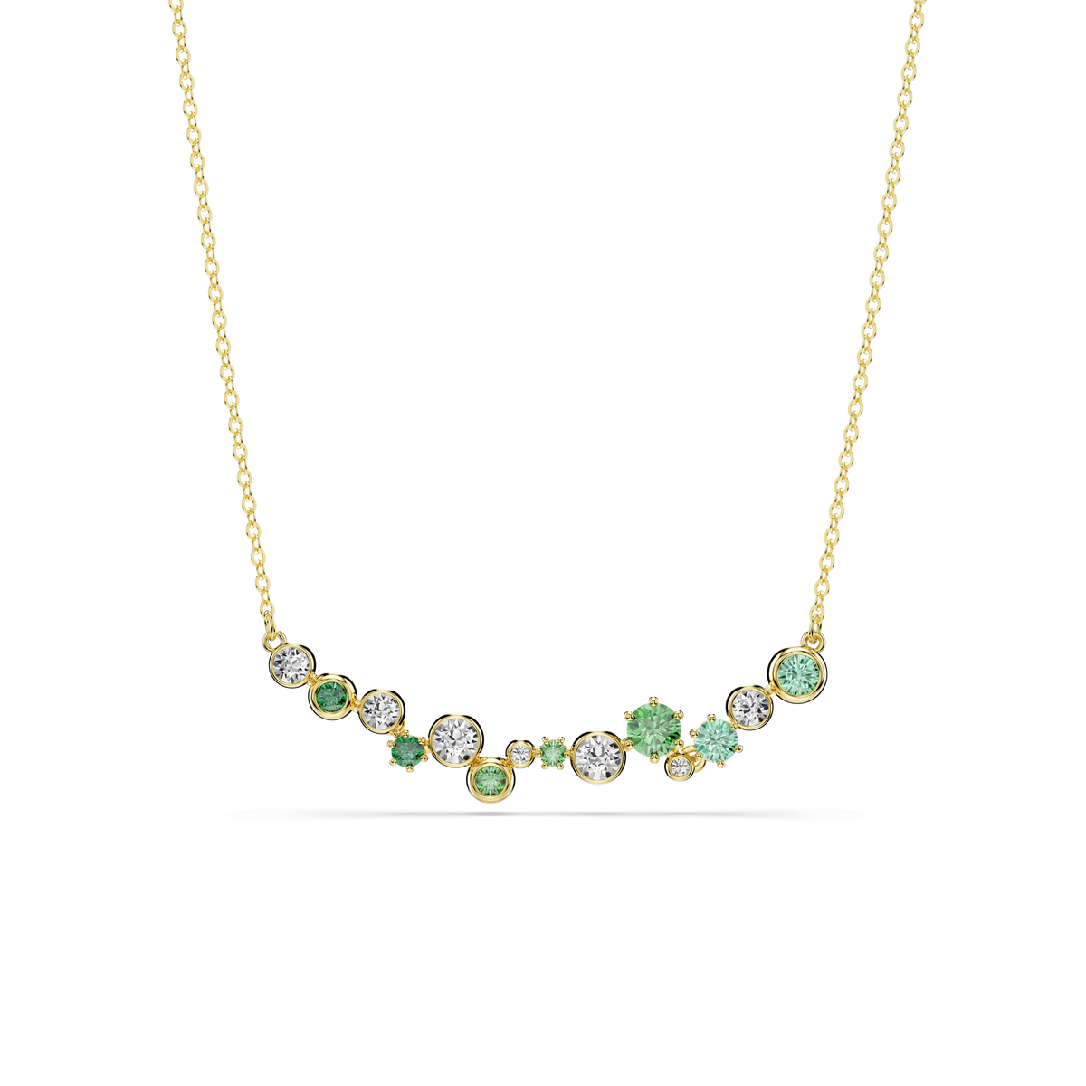 Introducing the Swarovski Constella necklace—a refined piece crafted with an 18K gold finish. This elegant accessory features a delicate chain adorned with an asymmetric cluster of mixed-cut green and clear Swarovski Zirconia stones arranged along the lower center, offering a sophisticated and graceful look.