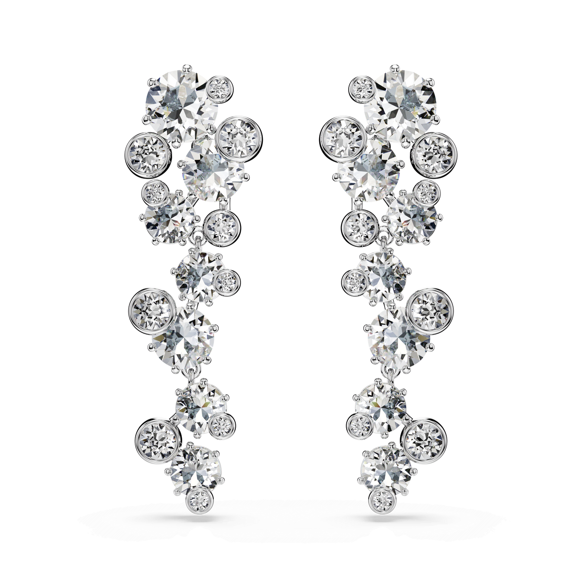 The Swarovski Constella drop earrings by Swarovski feature a rhodium-plated finish and are adorned with mixed-cut, dazzling white crystals in a cascading, curved design against a white background.