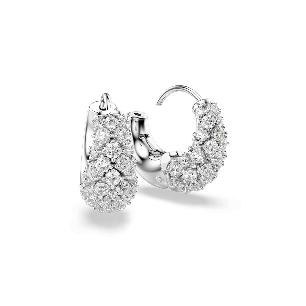 A pair of Swarovski Sublima earrings by Swarovski, featuring a rhodium-plated finish and adorned with sparkling white stones using the chatonnage technique, displayed against a plain white background.