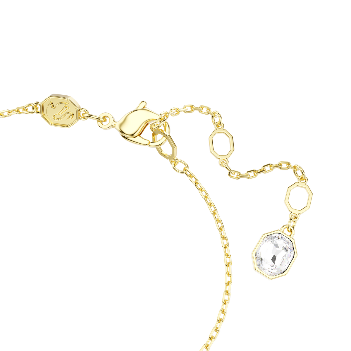 Close-up of a delicate gold-tone Swarovski Idyllia Bracelet featuring geometric links, a lobster clasp, and a clear faceted gemstone charm at the end. Set against a plain white background, this elegant piece from Swarovski showcases refined sophistication and sparkling allure, available at Raffi Jewellers.