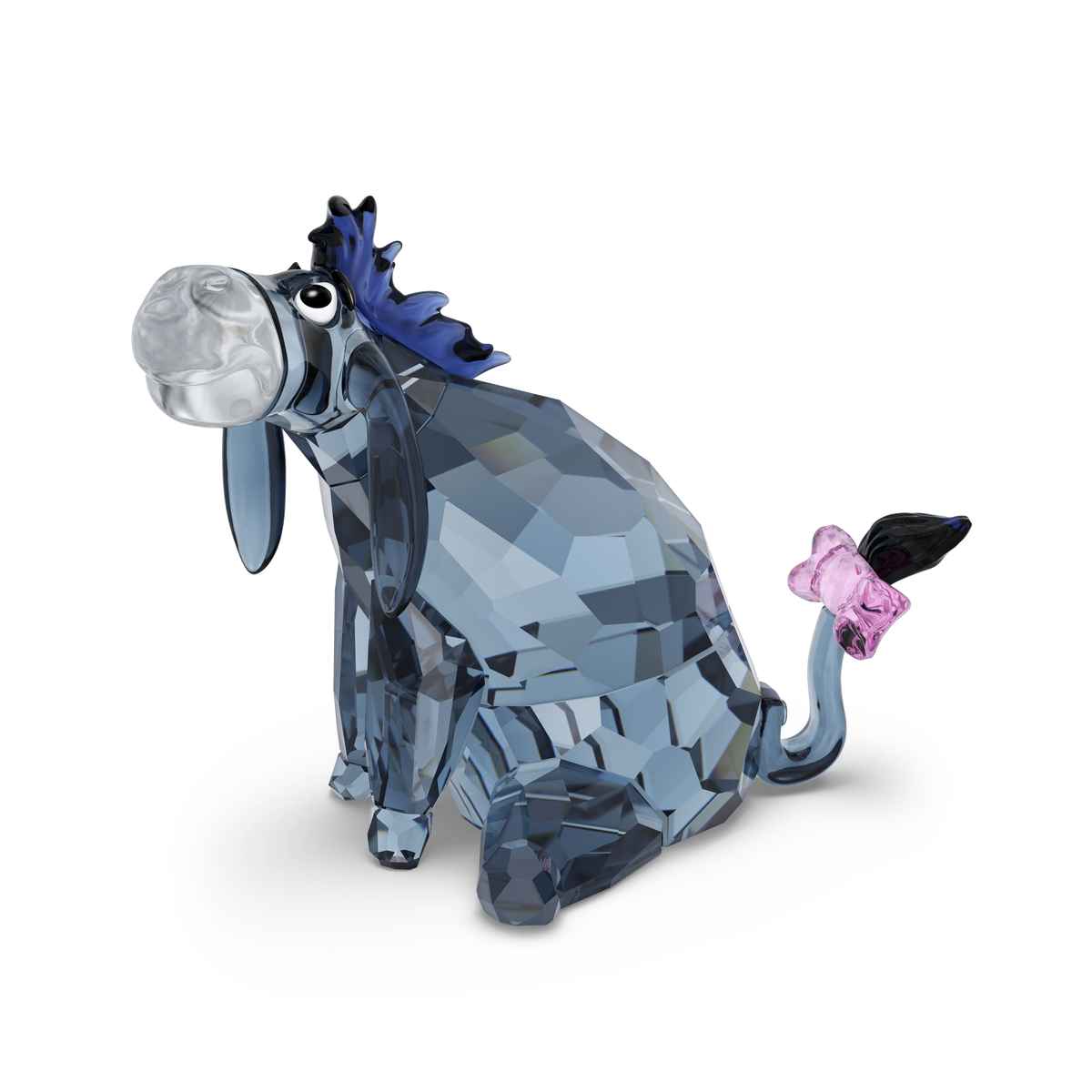 The Swarovski Winnie The Pooh Eeyore figurine by Swarovski features a faceted blue crystal design with a purple mane, floppy ears, and a pink bow on its tail, showcased against a plain white background—a delightful Disney collectible for fans.