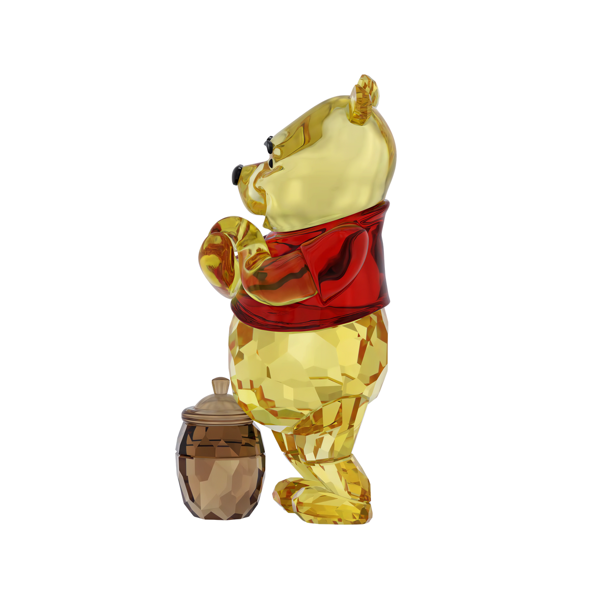 The Swarovski Winnie The Pooh figurine by Swarovski features Winnie the Pooh in his classic red shirt, standing beside a honey pot, all beautifully displayed against a plain white background—an enchanting Disney collectible for any fan.