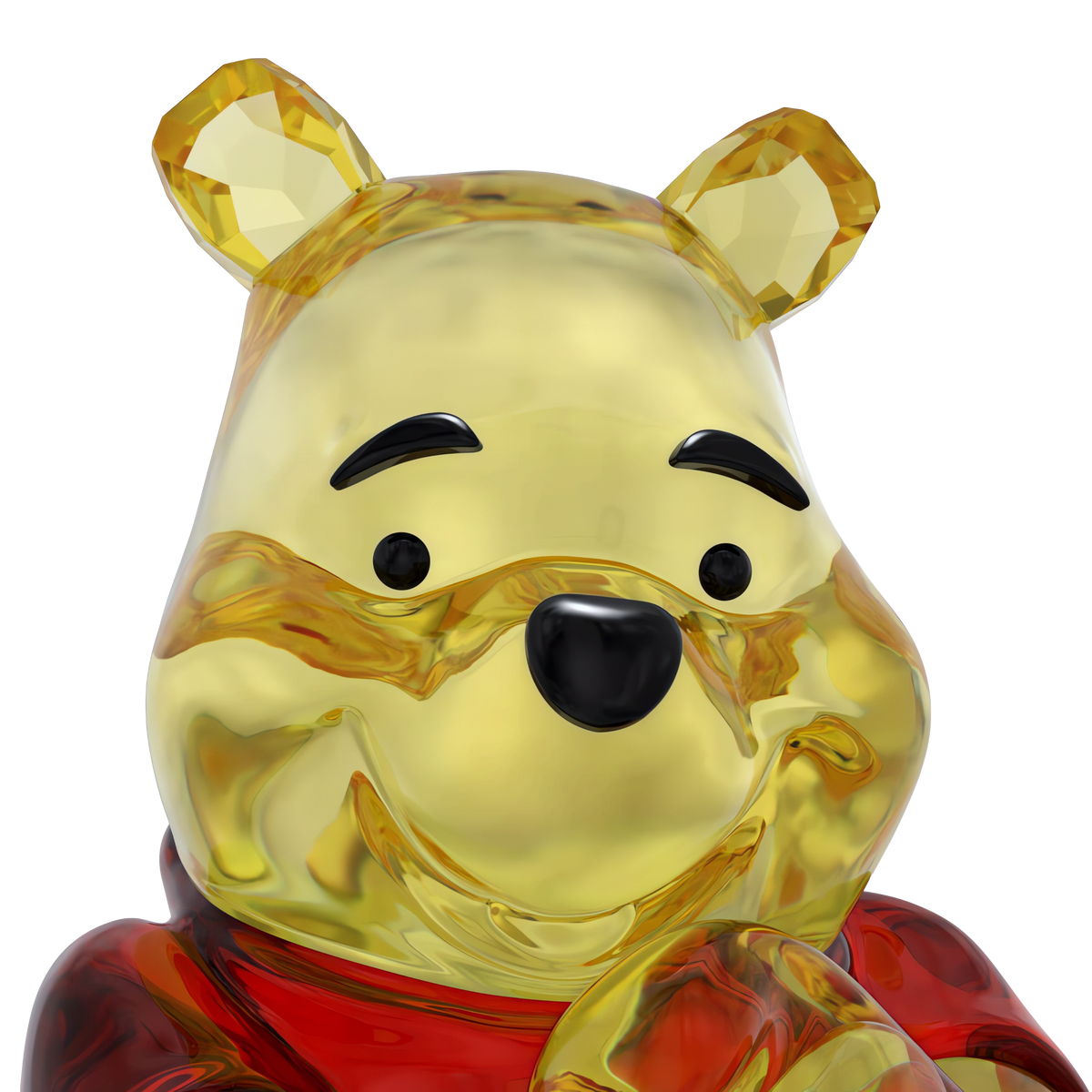 A close-up of the Swarovski Winnie The Pooh figurine by Swarovski, featuring a shiny, translucent yellow bear with black eyes, a black nose, and red clothing, crafted in the iconic style of a Disney collectible.