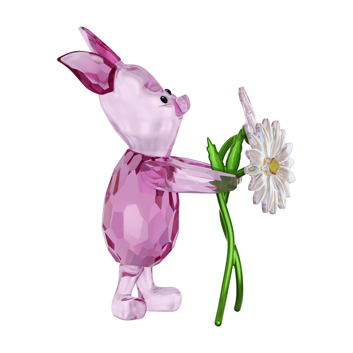 The Swarovski Winnie The Pooh Piglet figurine by Swarovski stands upright, holding a white crystal daisy with a green stem, against a plain background.