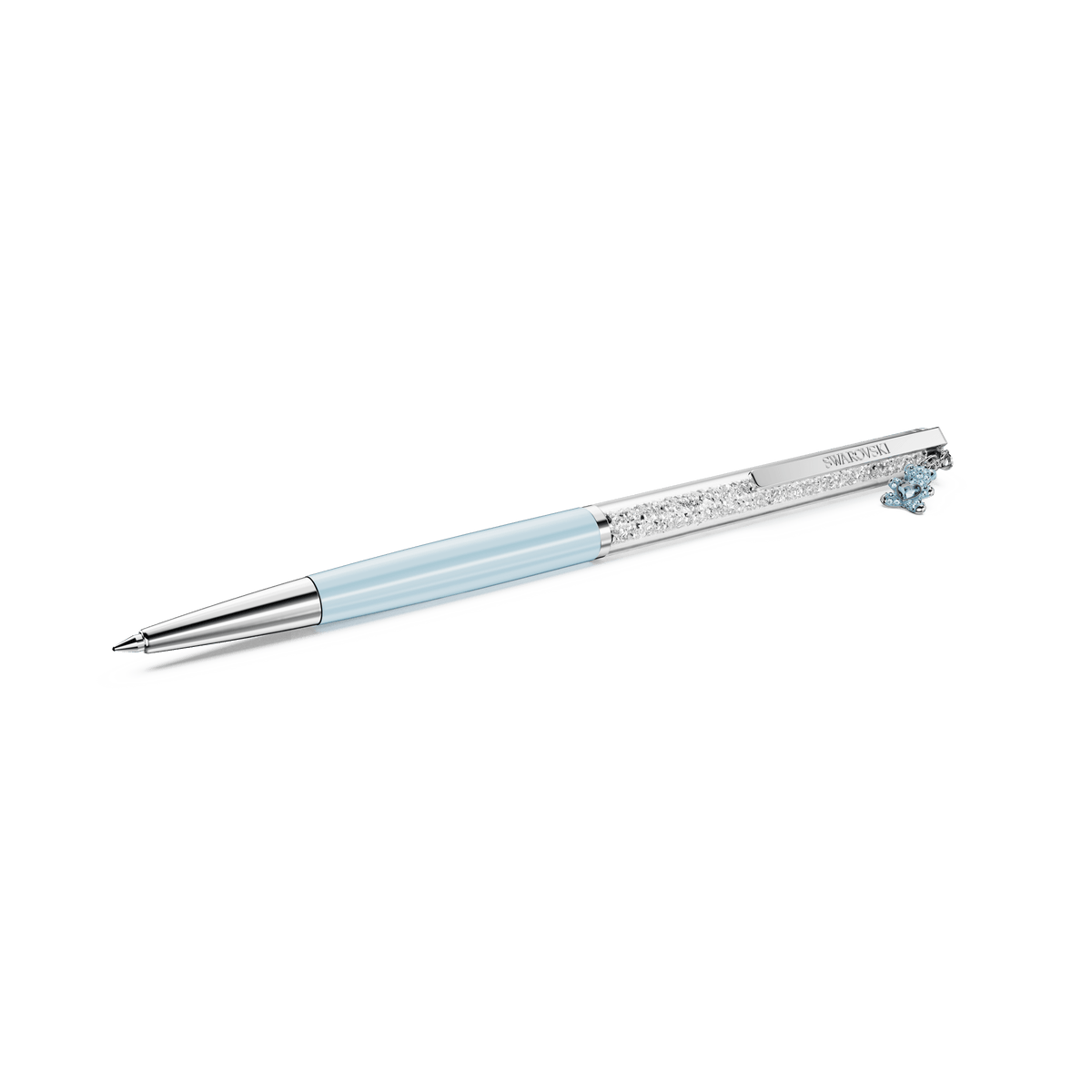 The Swarovski Crystalline ballpoint pen, Teddy edition, features blue lacquered accents and chrome-plated detailing. Showcasing intricate crystal embellishments and a decorative clip with a small blue charm near the top, this elegant pen by Swarovski is displayed against a plain white background.