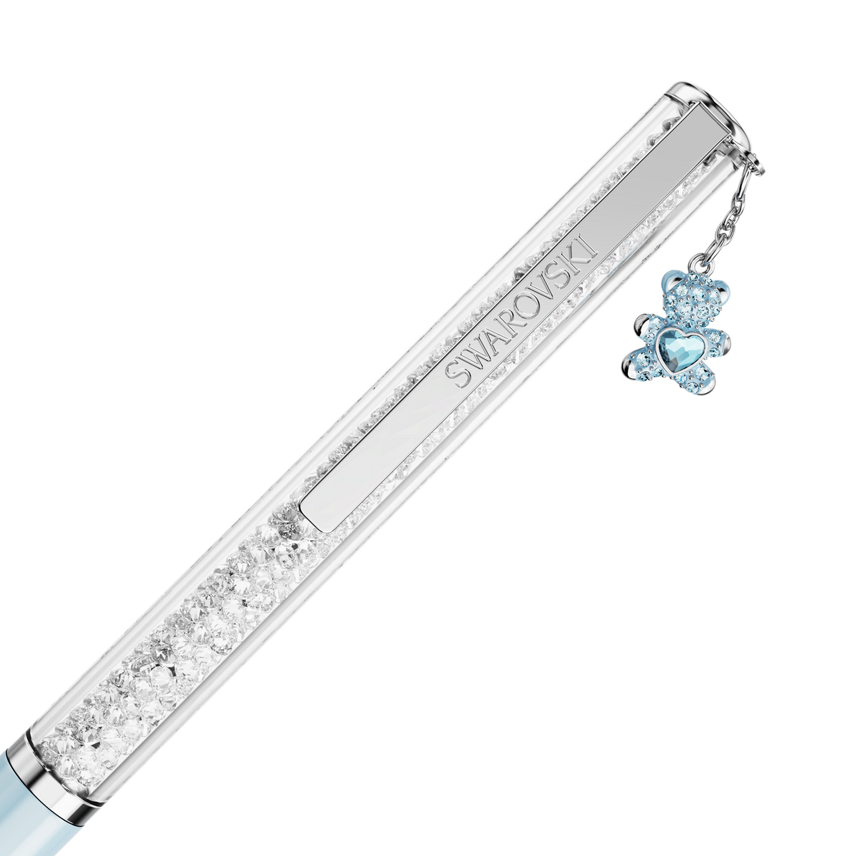 A Swarovski Crystalline ballpoint pen with a blue lacquered barrel and chrome-plated accents, adorned with clear crystals and finished with a charming blue teddy bear heart charm hanging from the top.