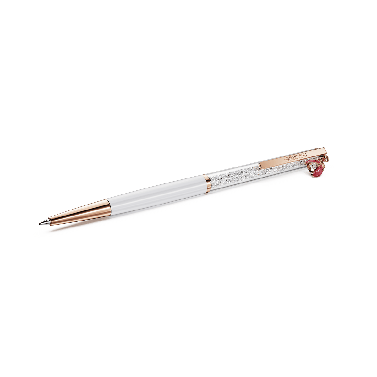 A Swarovski Crystalline ballpoint pen in white and rose gold-tone plating, featuring a clear section filled with crystals, a red lacquered ladybug motif, and a gemstone accent on the clip, displayed against a plain white background.