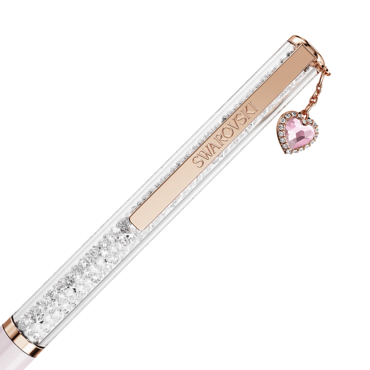 The Swarovski Crystalline ballpoint pen features pink lacquer, a rose gold-tone plated clip engraved with “SWAROVSKI,” and a dangling pink heart charm embellished with sparkling clear crystals.