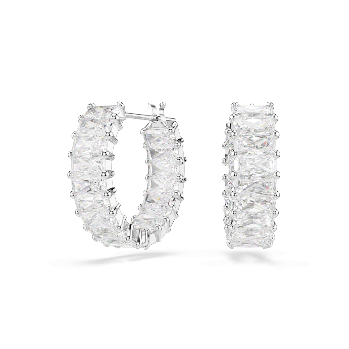 The Swarovski Matrix hoop earrings by Swarovski feature a pair of rhodium plated mini hoops adorned with multiple baguette-cut white stones, sparkling with Swarovski Zirconia, and are presented against a plain white background.